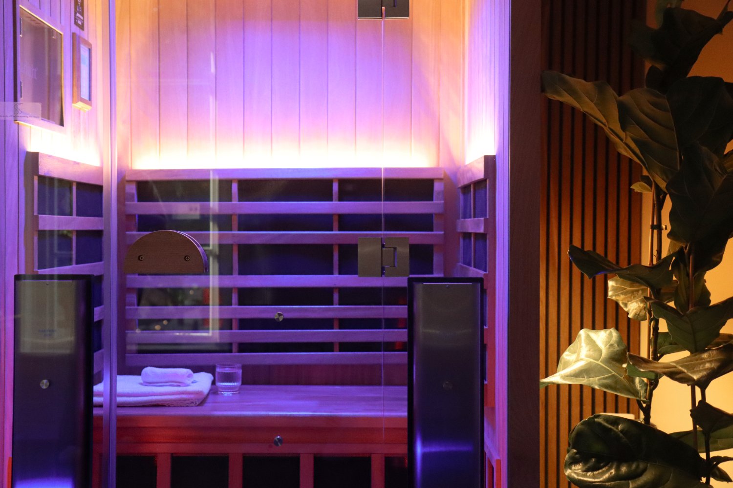 Close-up of the infrared sauna bench under colour-changing light